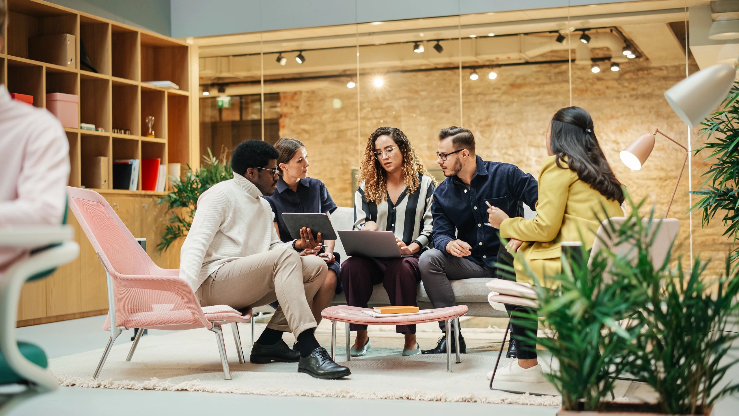 Businesspeople discussing ideas in a modern office meeting room